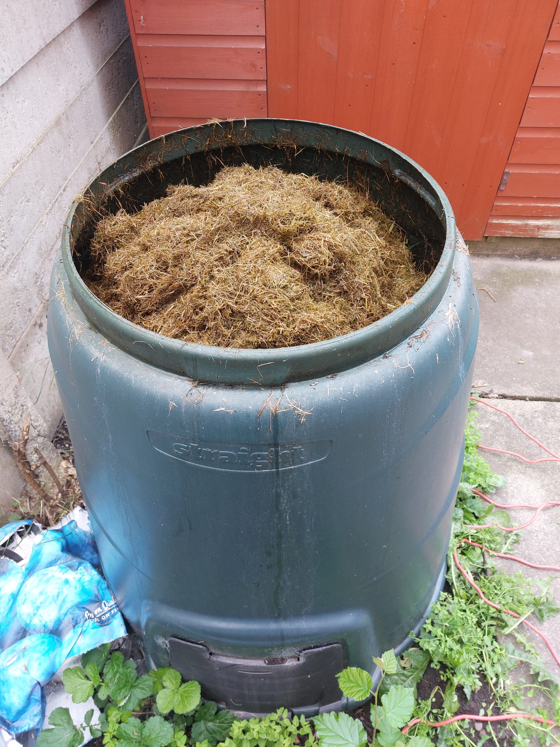 Green plastic garden compost bin